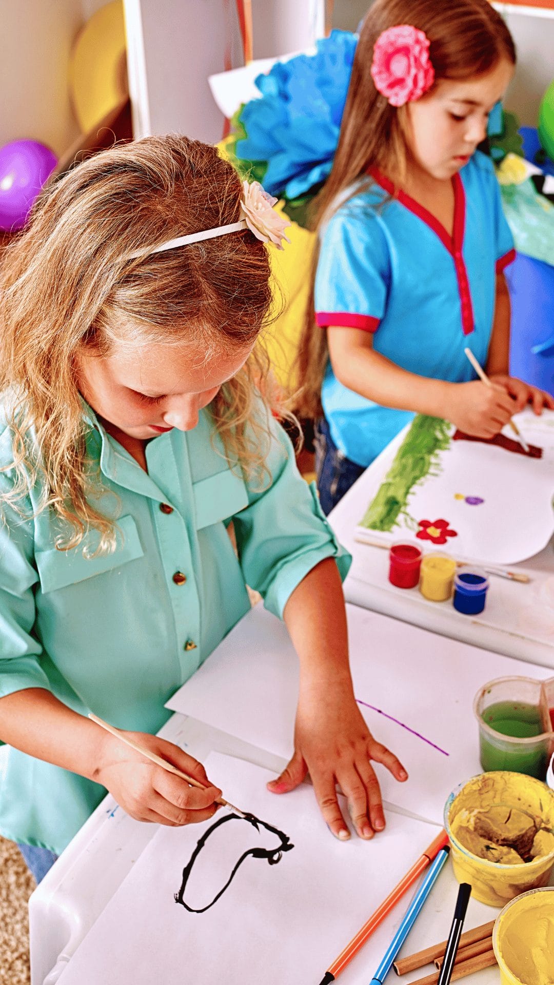 Two young students doing arts and crafts