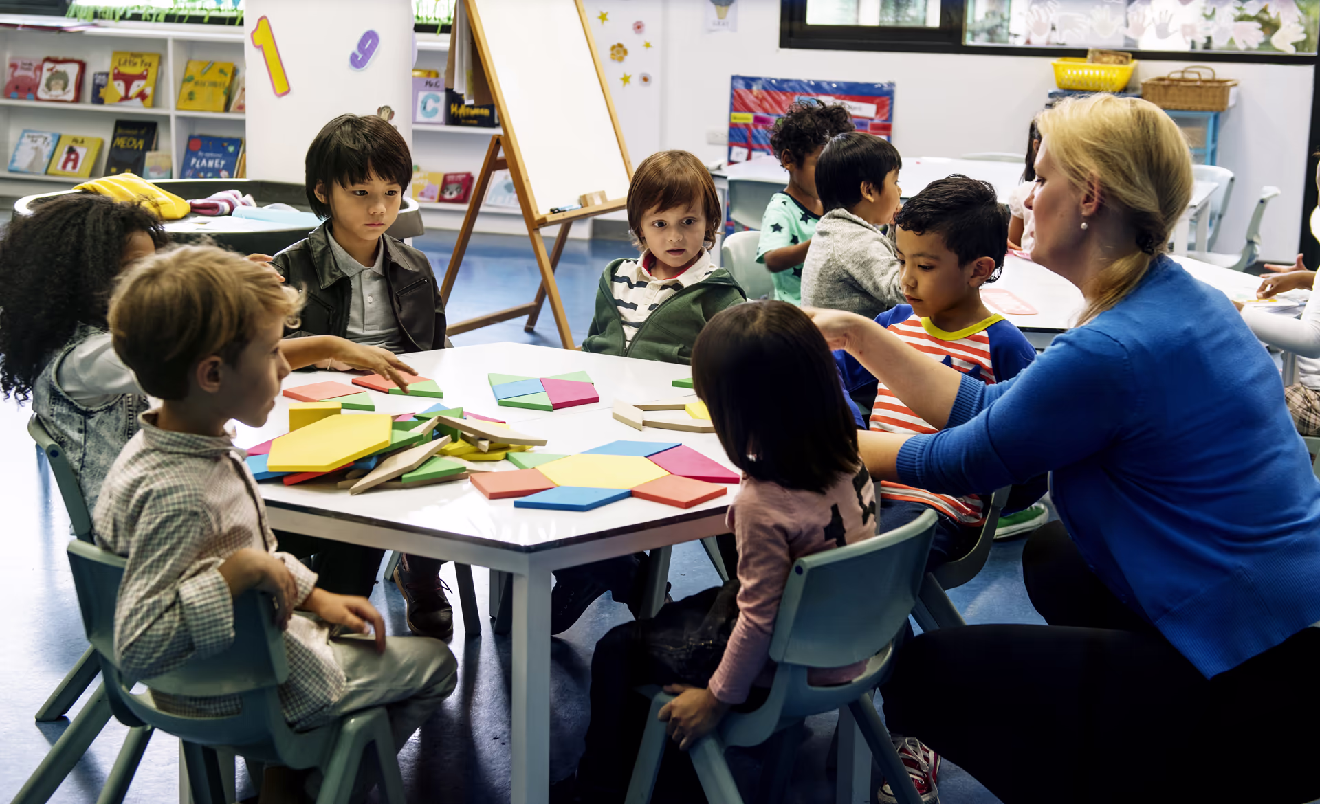 children-learning-shapes-with-teacher-at-school-ta-2026-03-18-08-14-09-utc
